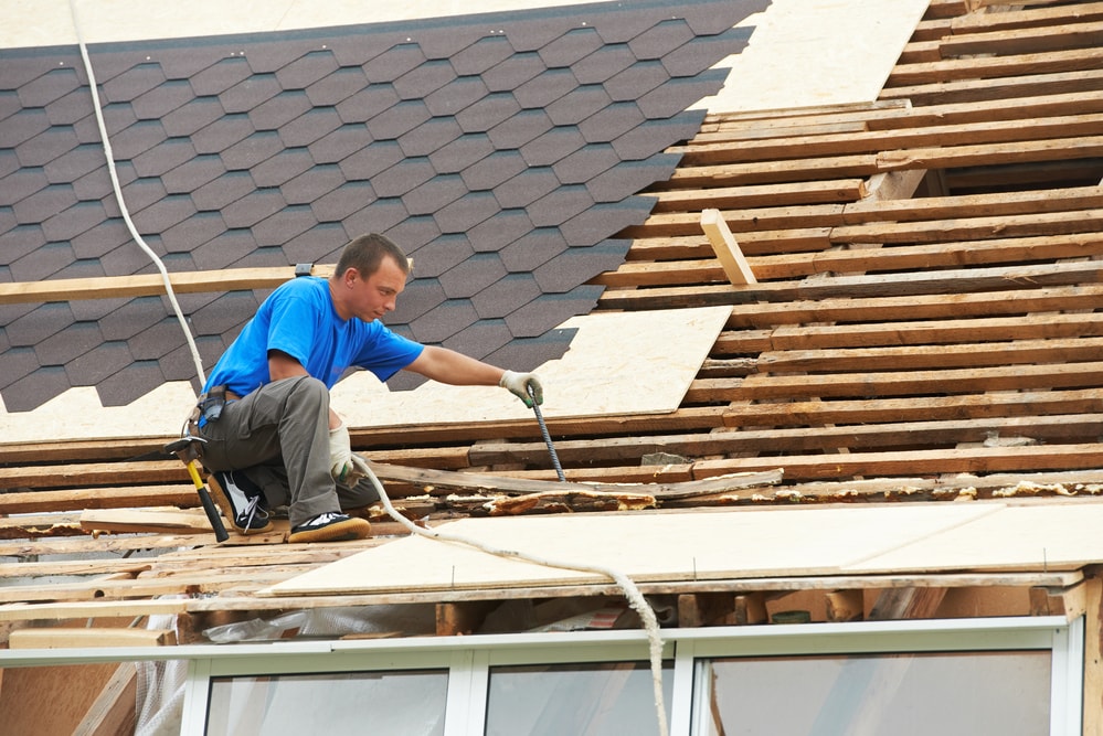 man working on a pocatello roof