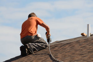 Roofing Contractor installing shingles in Idaho Falls